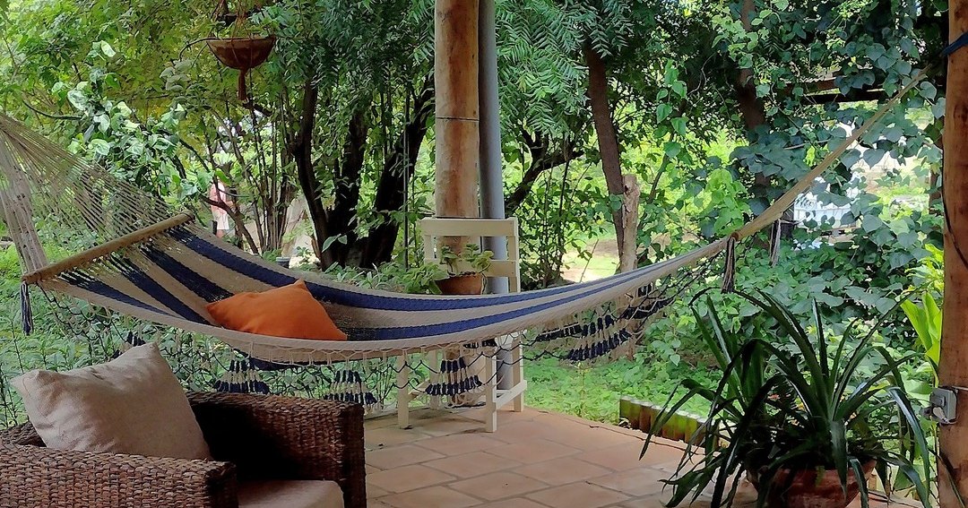 Striped hammock on the garden patio
