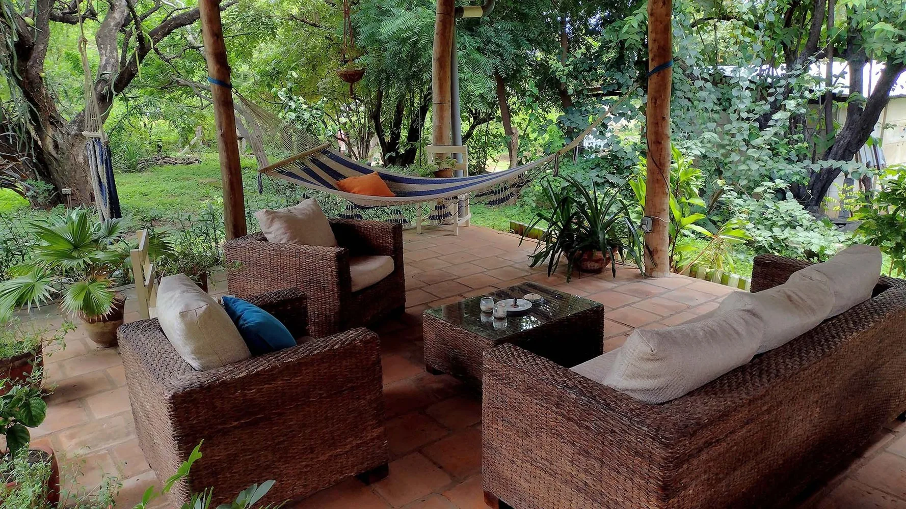 Outdoor rancho with hammocks and seating at Casa Todo Bueno