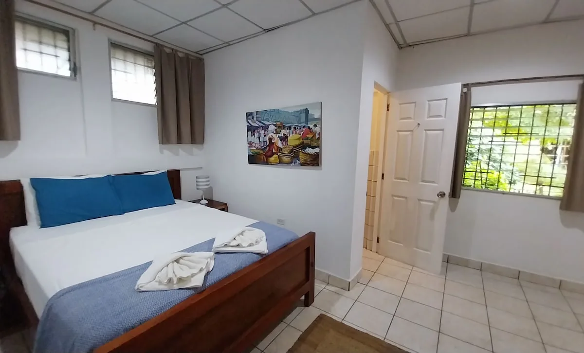 South Room with queen bed and private en-suite bathroom at Casa Todo Bueno